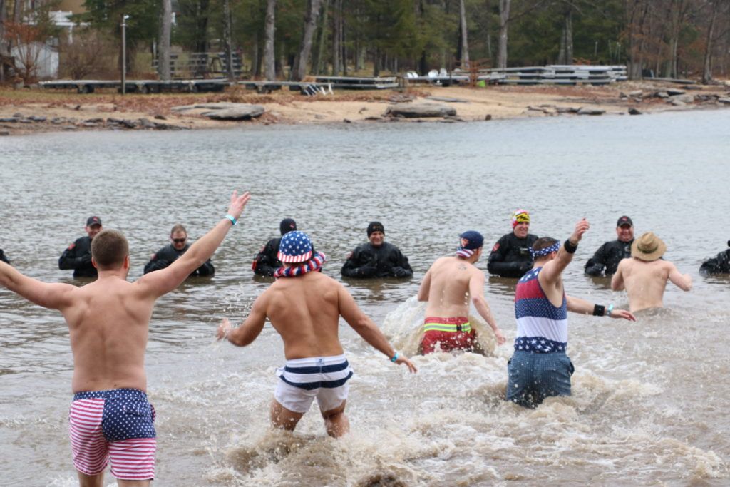 Team Running in Water at Deep Creek Dunk